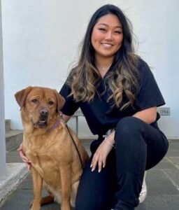 Dr. Yu-Jin Chang with a dog patient